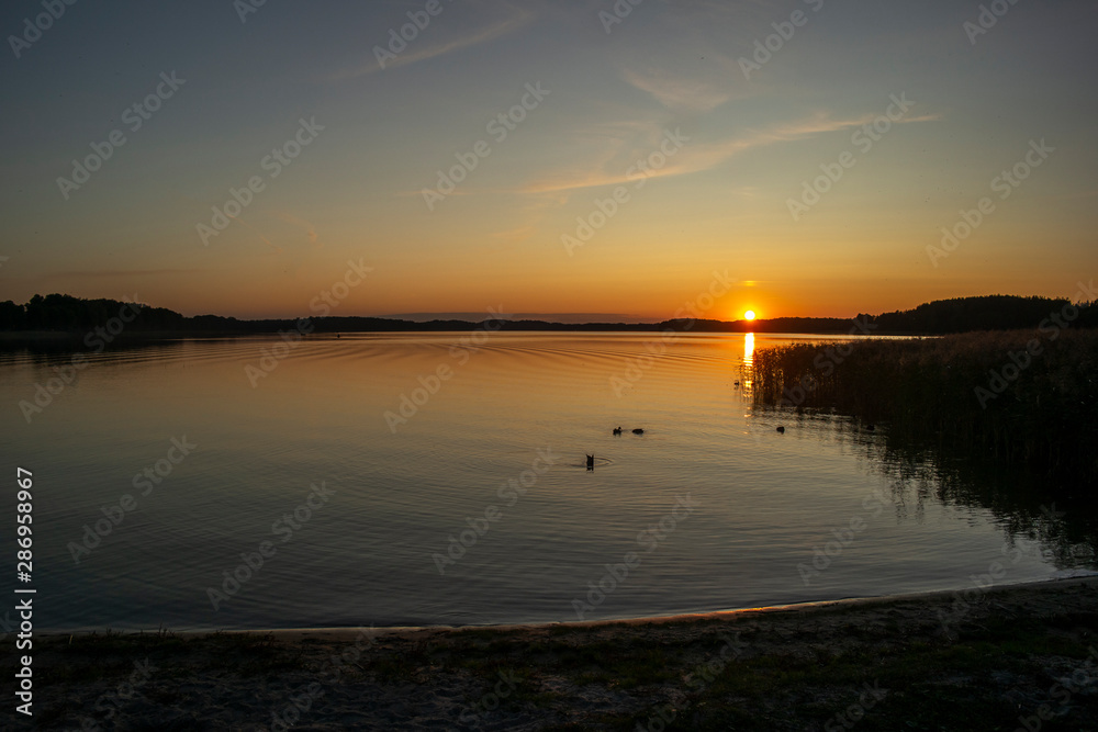 Beautiful summer sunset on the lake. Euro-trip