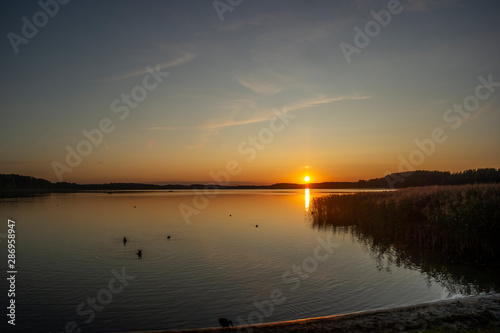 Beautiful summer sunset on the lake. Euro-trip