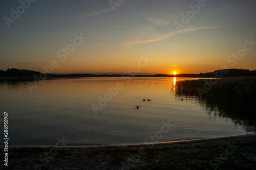 Fototapeta Naklejka Na Ścianę i Meble -  Beautiful summer sunset on the lake. Euro-trip
