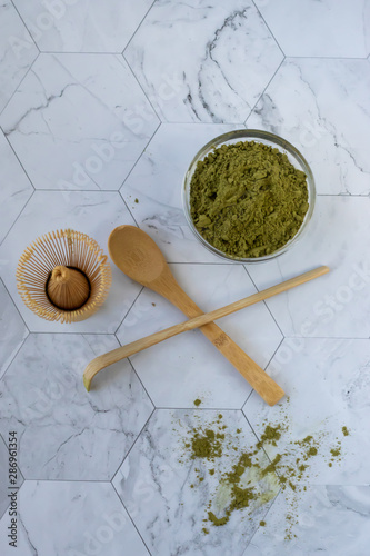 Matcha green latte tea with coconut milk. This latte is a tasty way to enjoy the energy and health benefits of a match. Matcha is a green tea leaf powder filled with antioxidants. View from above