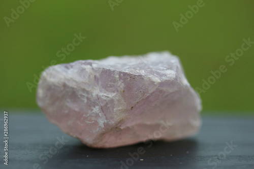 fluorite stone mineral crystal sample for science and geology isolate on green background
