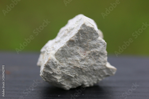 Photos Kaolinite stone isolate on green  background