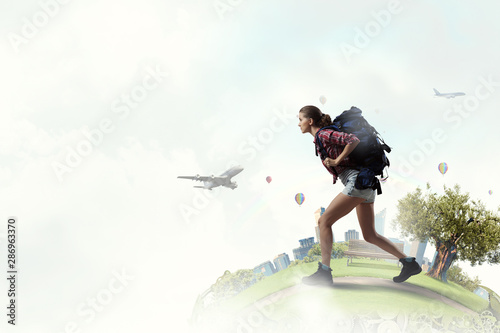 Travelling female tourist with backpack