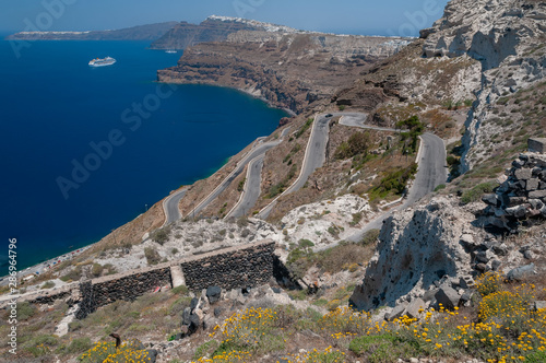 Hairpin road to Athinios port and Aegean sea, Santirini island.