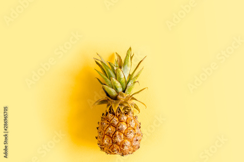 Top view pineapple isolated on yellow background with copy space for text. Template blog social media. Food concept. Minimal style. flat lay