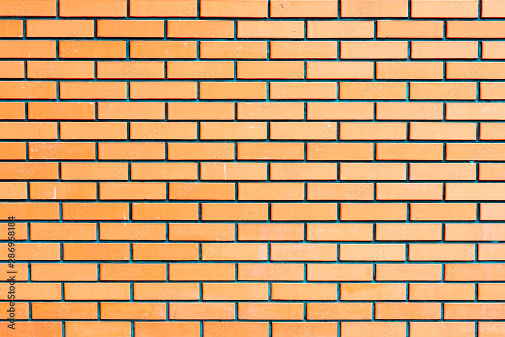 Texture of a brick wall with cracks and scratches which can be used as a background Texture of a brick wall with cracks and scratches which can be used as a background