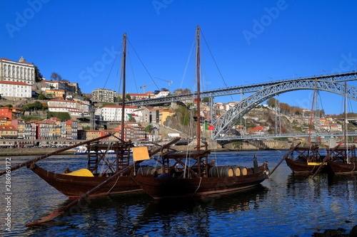 Traditional rabelo boats, Porto city skyline, Douro river and and Dom Luis or Luiz iron bridge. Porto © Rudolf Tepfenhart