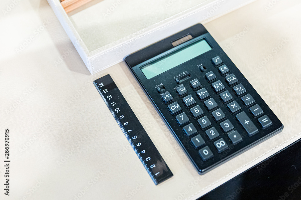 Business background, Calculator with ruler Business background, Calculator with ruler