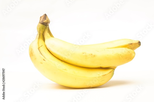 Yellow fresh banana isolated against white, selective focusing