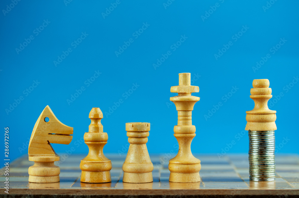 pawn with money in front of the king, the concept of success, business Finance wealth, power and career growth.