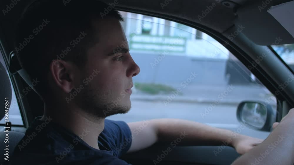 Man drive the car in city, in summer day. 4k. taxi driver at work.