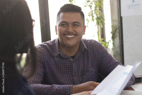 close up portrait of asian young man with female coworker