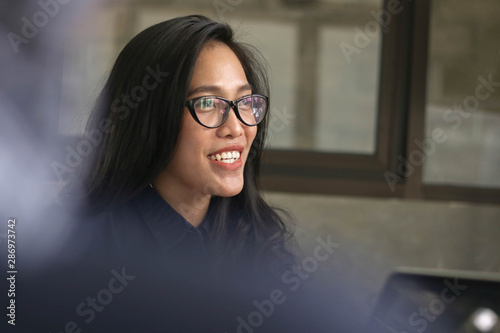 young asian women smiling at work interview, female talk with woman coworker at office