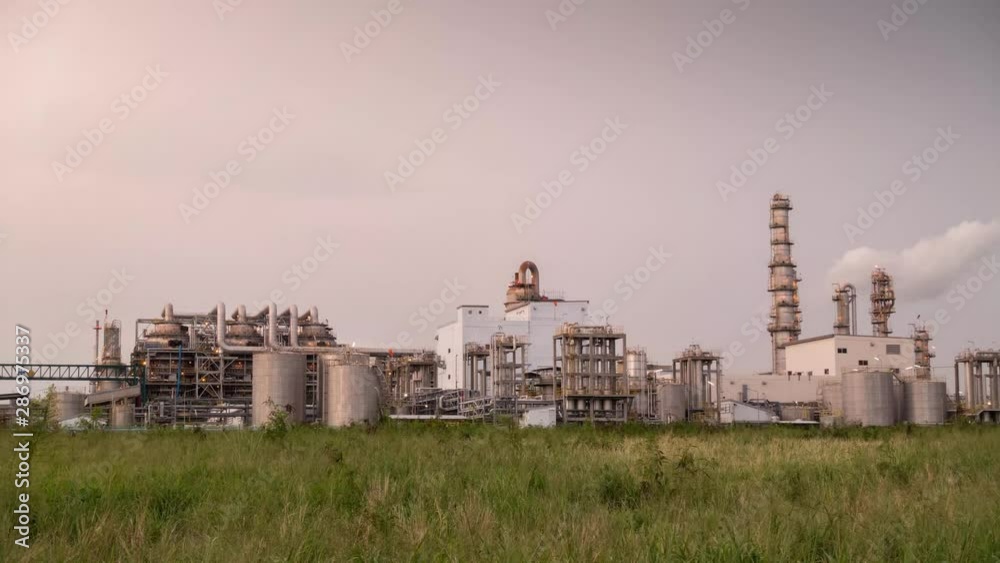 time lapse during day to nigh of petrochemical plant with worker, tank, stack, distillation column and office in petroleum and chemical industrial during sunset time time lapse during day to nigh of petrochemical plant with worker, tank, stack, distillation column and office in petroleum and chemical industrial during sunset time