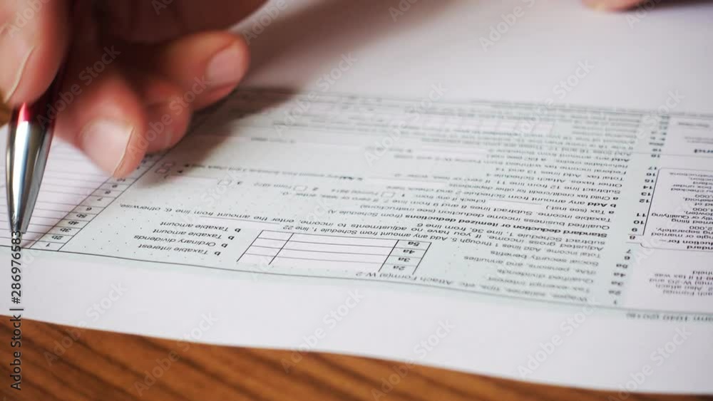 Tax refund concept. USA tax form 1040, pen, dollar bills, bit-coins. Tax refund concept. USA tax form 1040, pen, dollar bills, bit-coins.