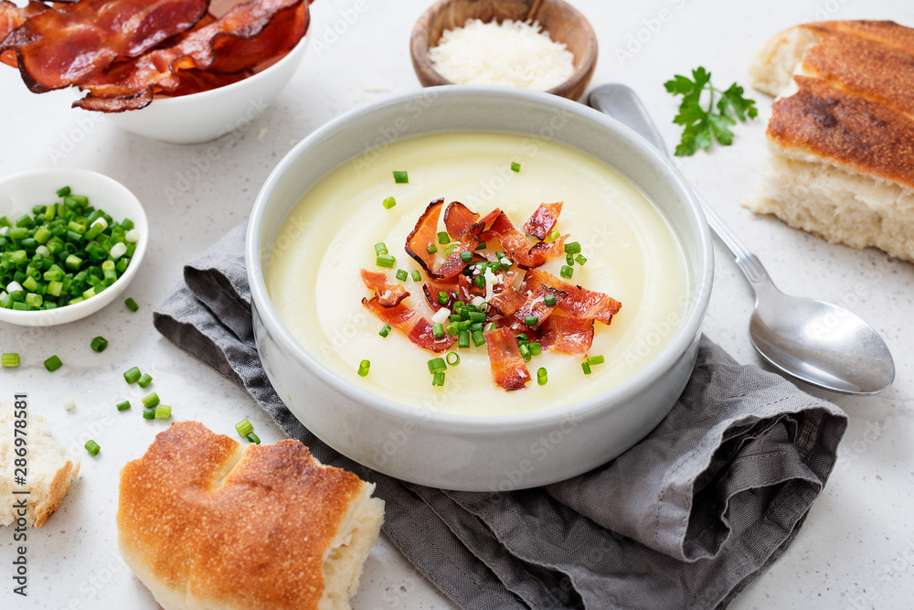 Potato cream soup with bacon, green onion and cheese. Potato cream soup with bacon, green onion and cheese.