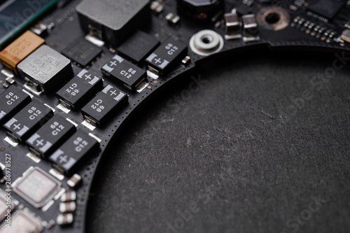 A black colour waterproof Printed Circuit Board with CPU, SMD & IC mounted part on board photo