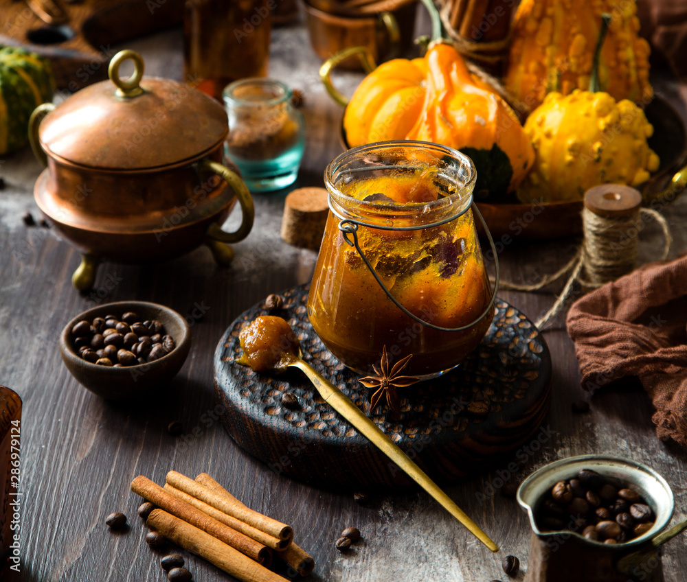 homemade pumpkin spice mix in glass jar on rustic wooden table homemade pumpkin spice mix in glass jar on rustic wooden table