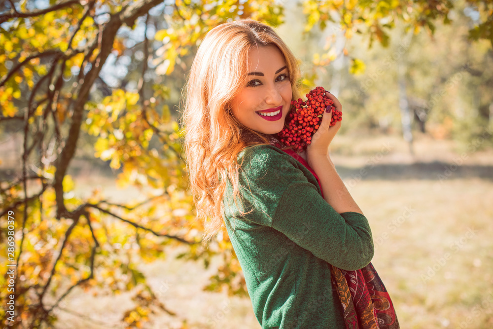 Autumn golden time, portrait of fashionable woman in park outdoors Autumn golden time, portrait of fashionable woman in park outdoors