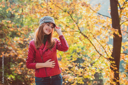 Autumn golden time, portrait of fashionable woman in park outdoors