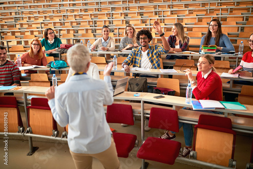 professor in university discussion with students.