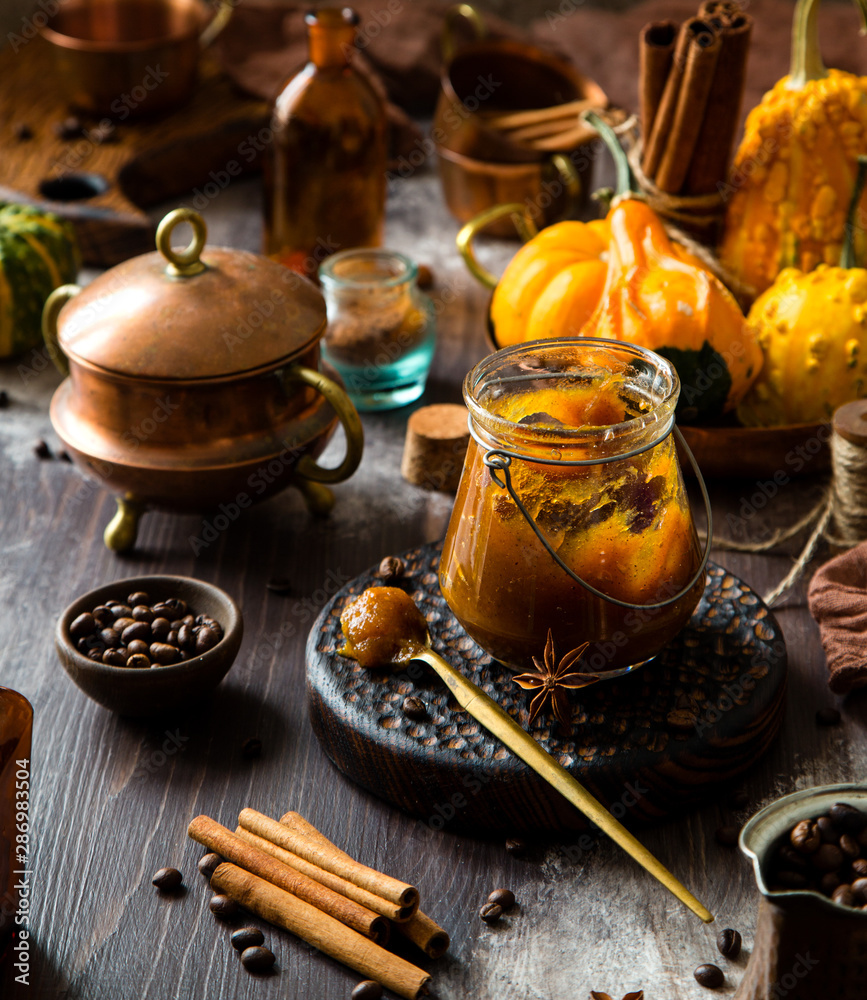 homemade pumpkin spice mix in glass jar on rustic wooden table homemade pumpkin spice mix in glass jar on rustic wooden table