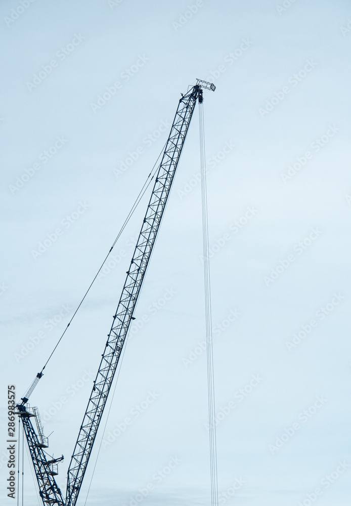 silhouette of crane and blue sky. background concept for engineering and building silhouette of crane and blue sky. background concept for engineering and building