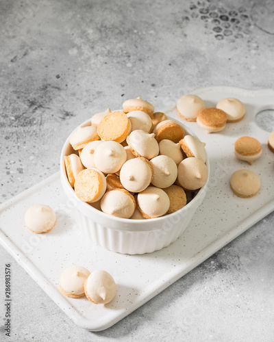 Butter cookies in a white vase on a light gray background