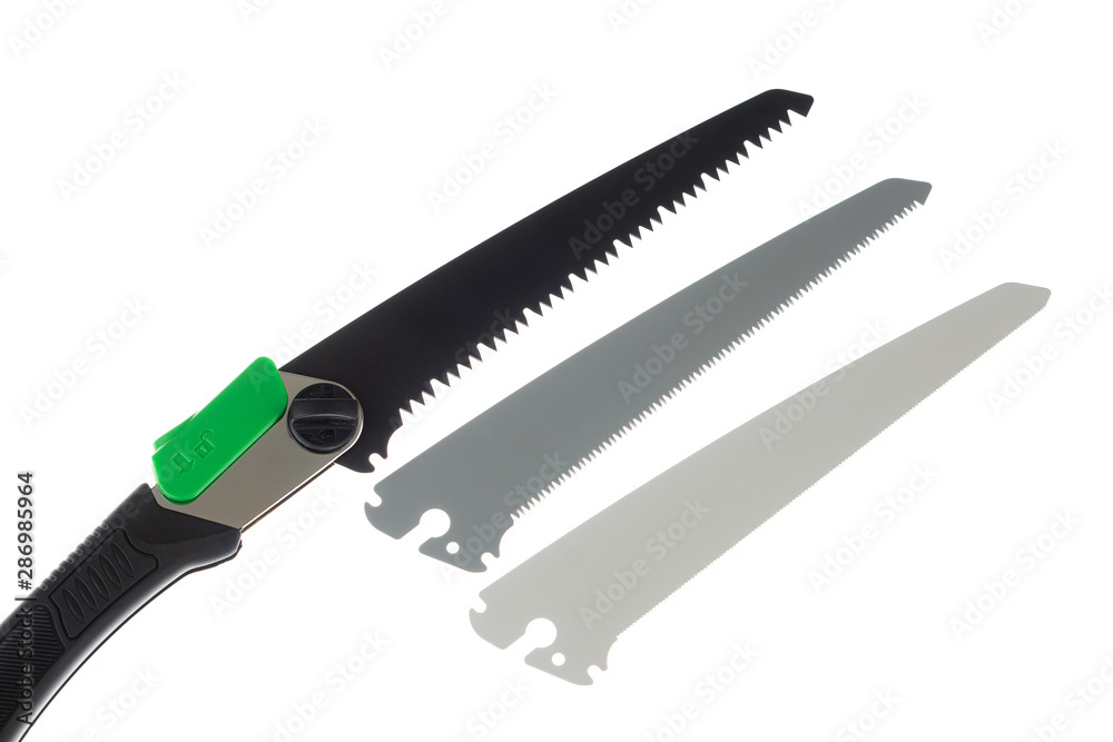 Folding handsaw and replaceable blades isolated on white Folding handsaw and replaceable blades isolated on white
