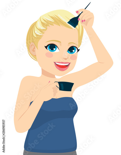 Young beautiful woman dying her hair blonde color