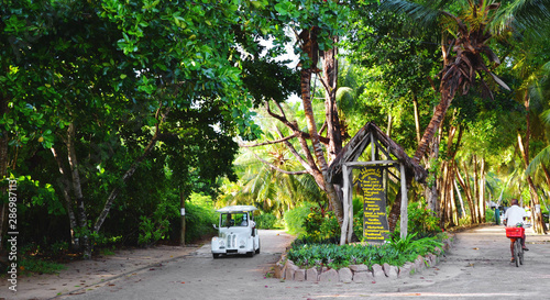 La Digue, Seychelles:  Entry to Union Estate Park with coconut  Palm Trees, vanilla plantation and lush green vegetation