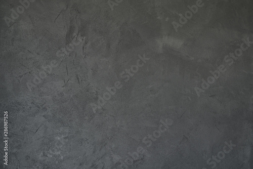 texture of dark gray wall with decorative plaster concrete effect