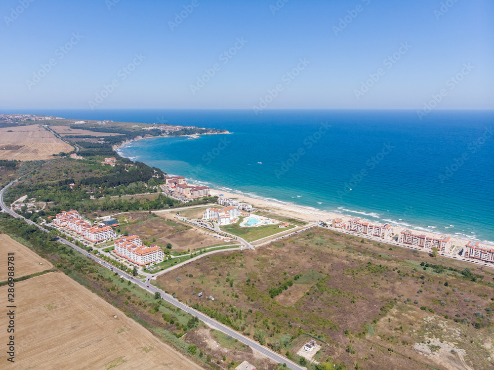 Aerial photo of the beautiful small town and seaside resort of known as Obzor in Bulgaria taken with a drone on a bright sunny day showing the hotels and fields of the holiday resort