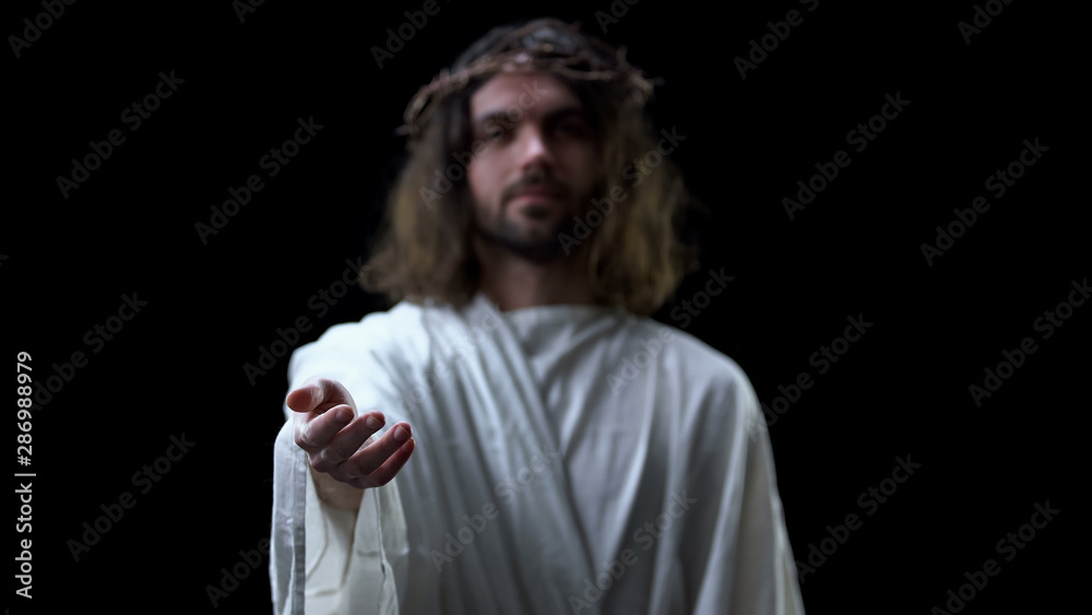 Helping hand of savior on dark background, religious help, forgiveness kindness Helping hand of savior on dark background, religious help, forgiveness kindness