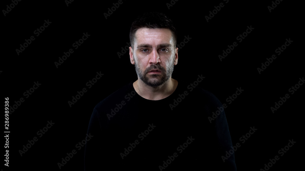 Crying depressed man looking camera, breakup depression, life crisis, grief Crying depressed man looking camera, breakup depression, life crisis, grief