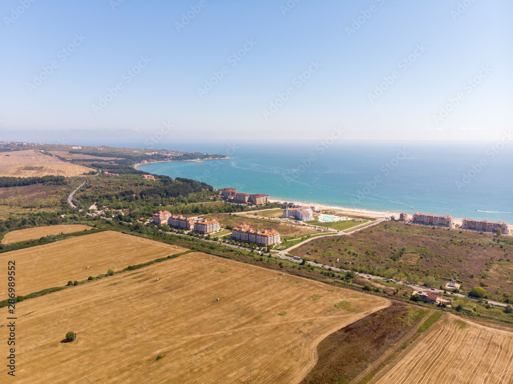 Aerial photo of the beautiful small town and seaside resort of known as Obzor in Bulgaria taken with a drone on a bright sunny day showing the hotels and fields of the holiday resort