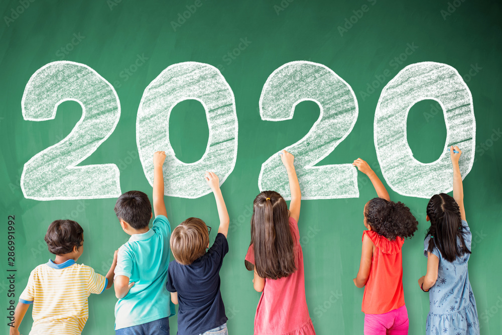 school children drawing 2020 new year on the chalkboard - obrazy, fototapety, plakaty 