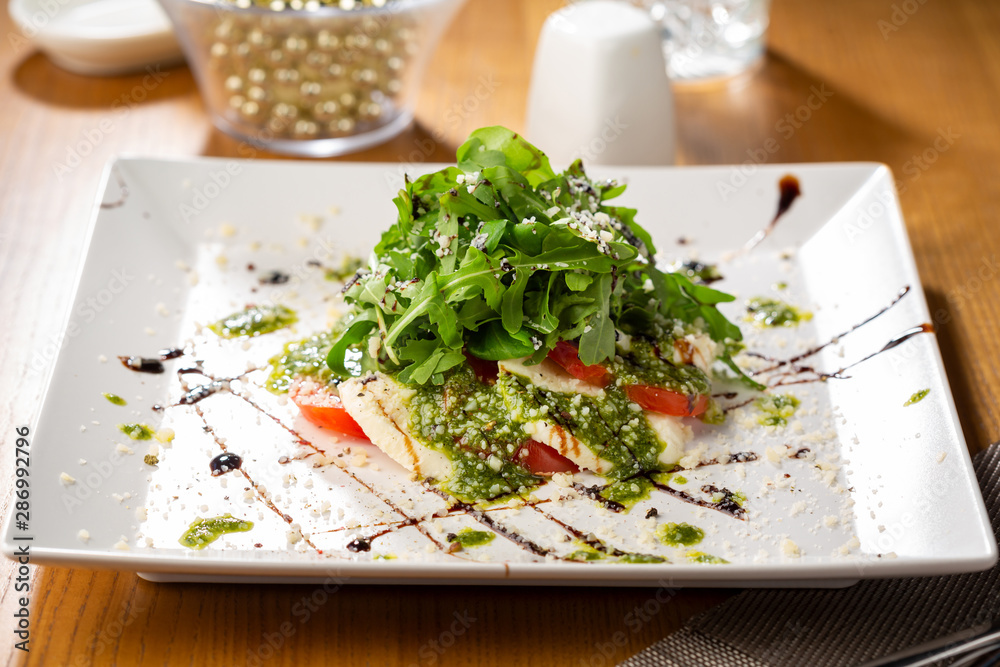 Caprese salad with sauce close-up Caprese salad with sauce close-up