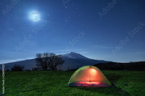 Night Full Moon On Illuminated Tent And Etna Mount, Sicily