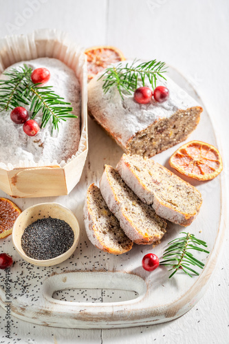 Tasty poppy seed cake for Christmas with orange and cranberry