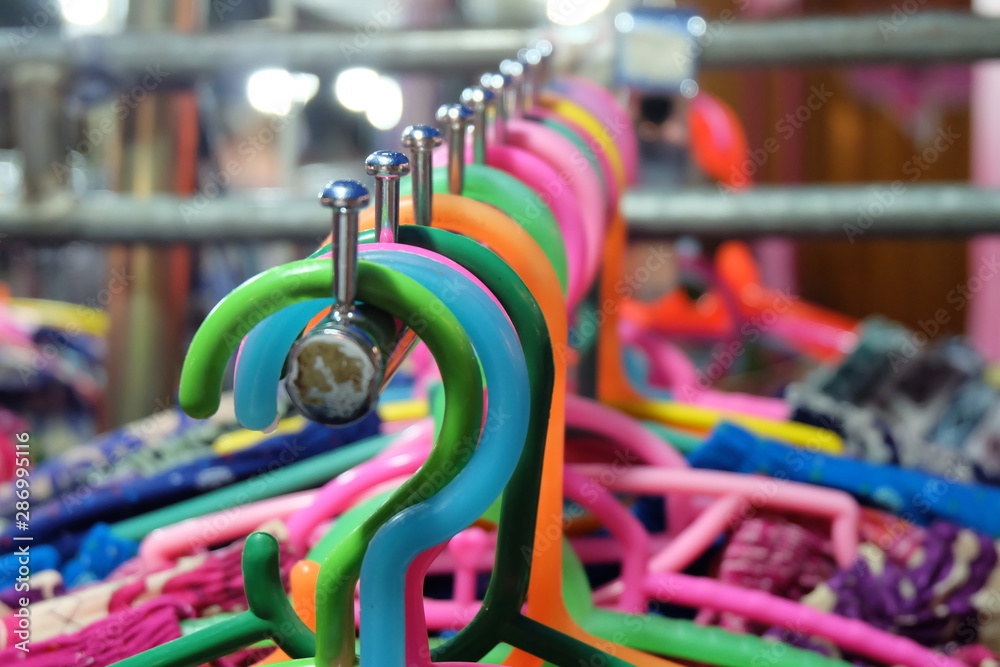 Plastic hanger.  color​ful​ plastic hanger.​ Plastic hanger for clothes at​ the​ local​ night​ market.
