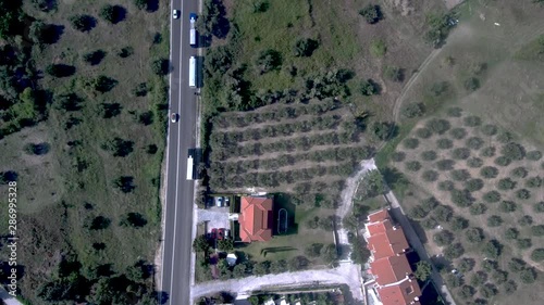 Aerial view of tourist residences beside road with cars, trees, Kriopigi in Halkidiki, Greece photo