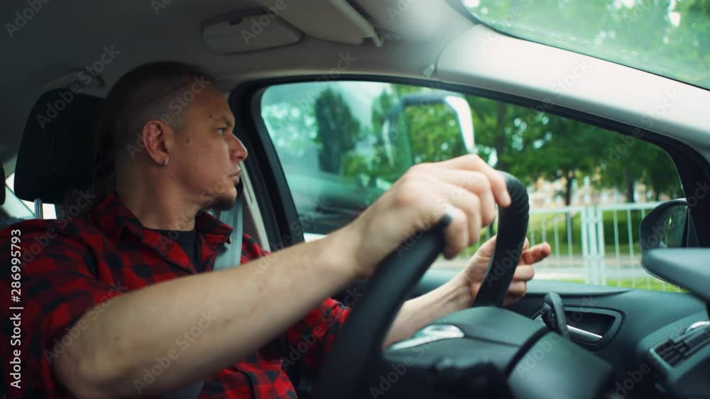 Angry driver shows middle finger. Angry driver shows middle finger.
