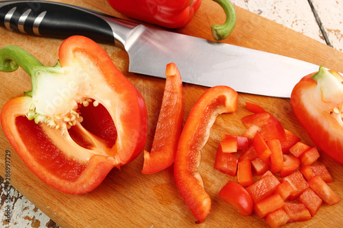 Red Bell Pepper Slices on wooden board