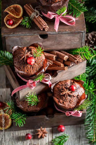 Sweet gingerbread muffins for Christmas in an old wooden box