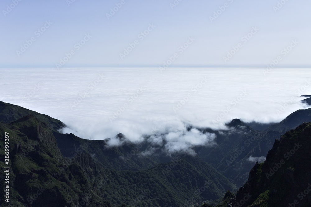 Panoramic view above clouds on 'Pico do Arieiro' (Sandbox Peak) and 'Pico Ruivo' (Redhead Peak) mountains (Madeira, Portugal)