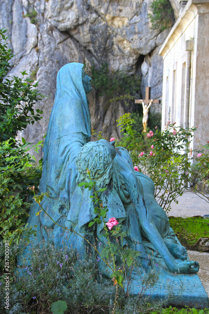 custom made wallpaper toronto digitalFrance, Sainte-Baume, august 23, 2019 : Statue of Mary Magdalene in front of the grotto entrance.
