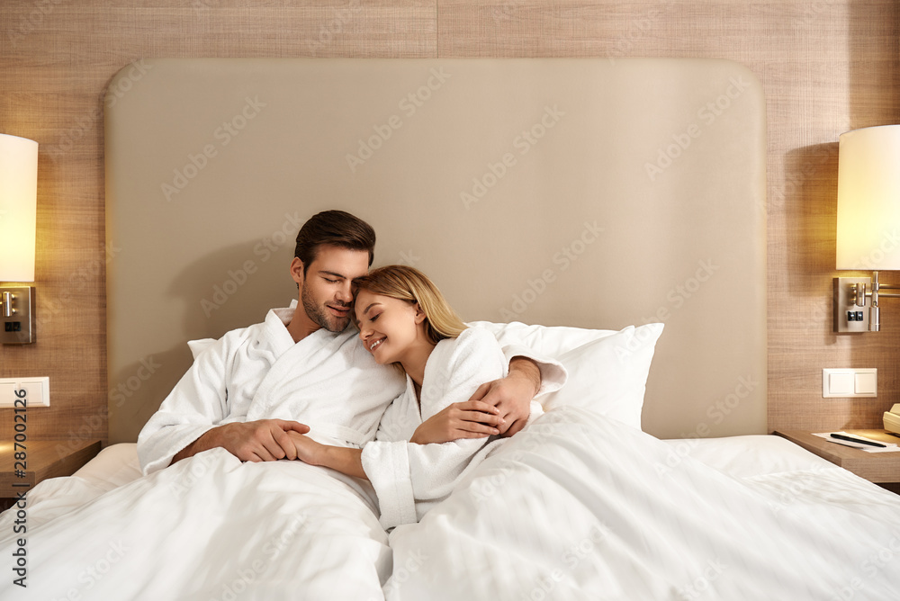 We are better together. Couple relaxing in hotel room wearing robes Stock  Photo | Adobe Stock