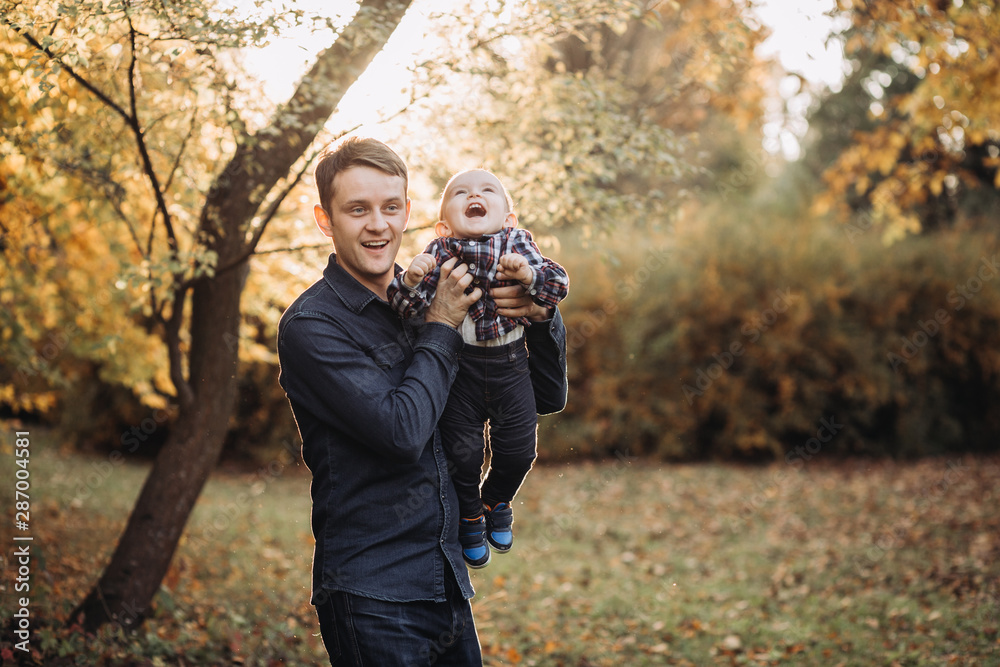 Father with a child in a beautiful autumn park