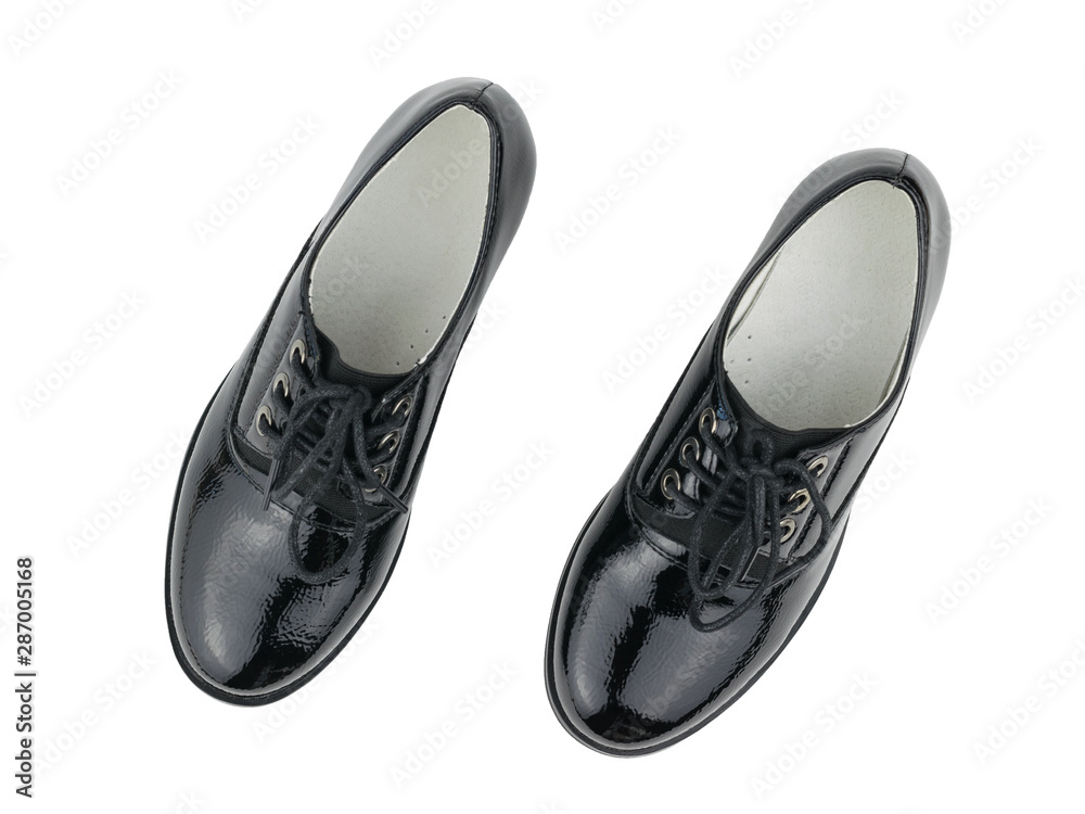 Two fashionable black women's shoes isolated on white background. The view from the top. Two fashionable black women's shoes isolated on white background. The view from the top.